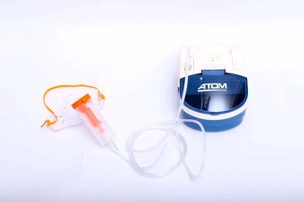 Atom piston nebulizer machine with adult and child masks, mouthpiece, filter and medication cup.
