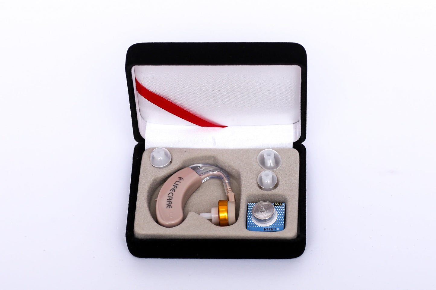 LifeCare LC 405 mini hearing aid amplifier box with 4 batteries and ear tips.