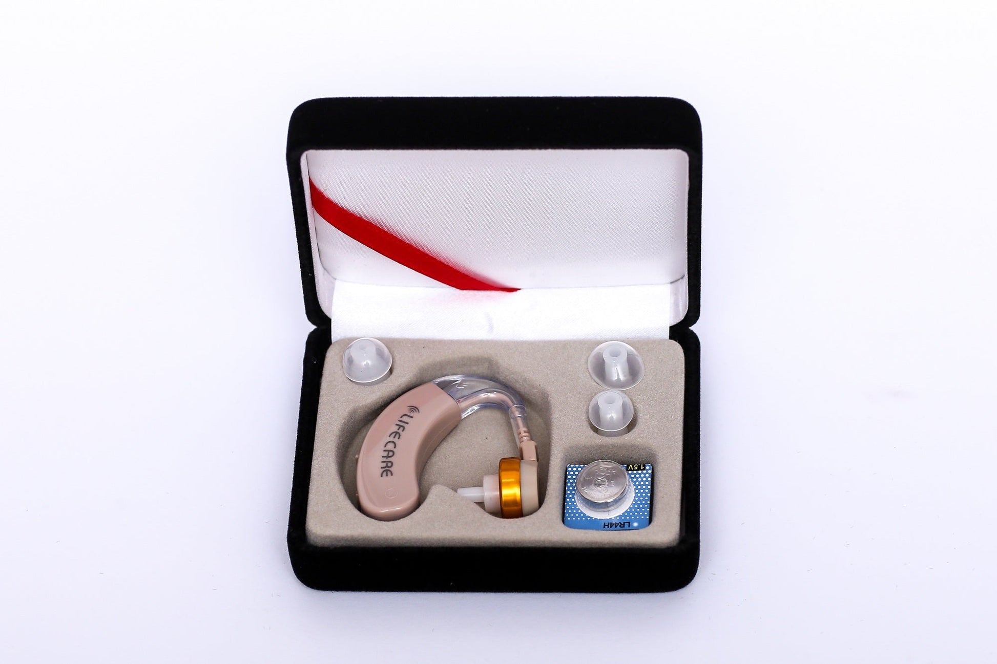 LifeCare LC 405 mini hearing aid amplifier box with 4 batteries and ear tips.